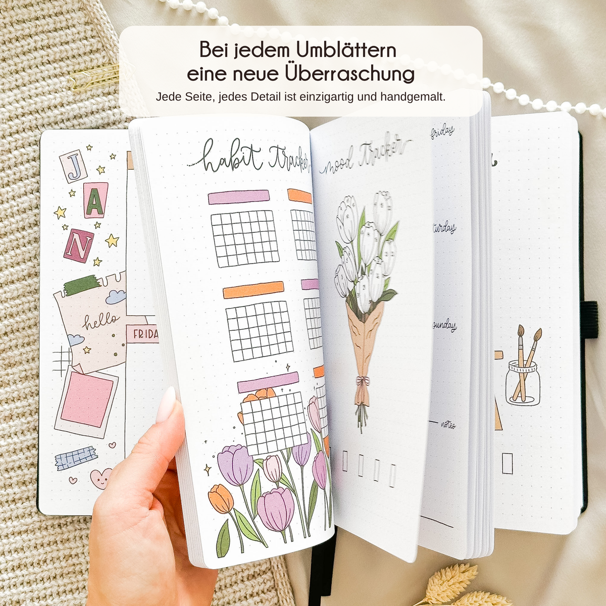 Open Black journal showing a hand-drawn monthly page, every page unique